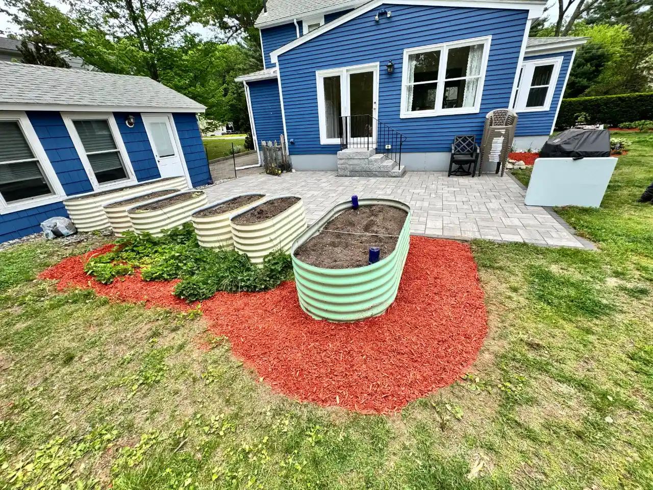 Yard cleanup on a residential property in Pembroke, Massachusetts