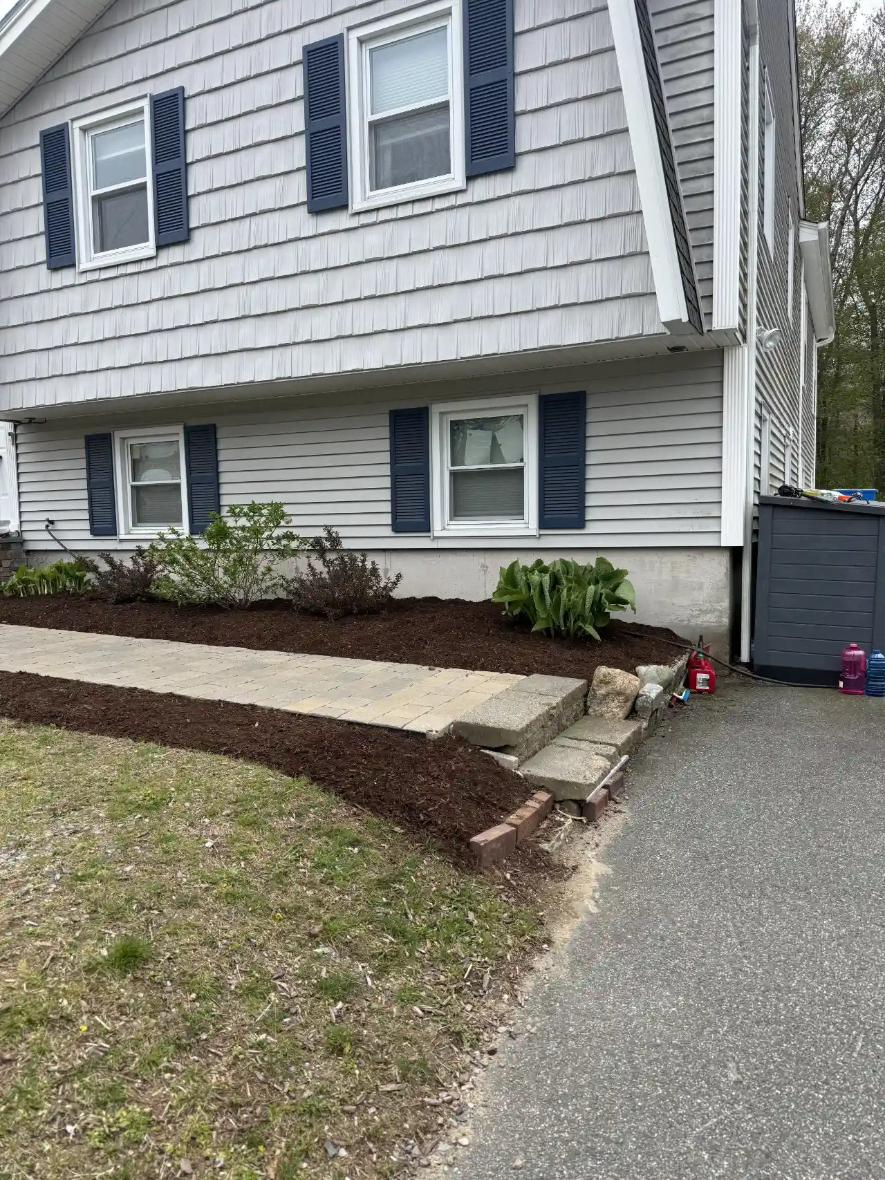 Completed mulching job on a residential lot in Norwell